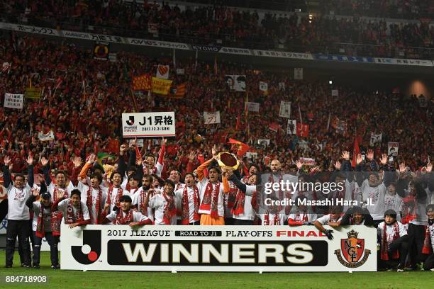 Nagoya Grampus players applaud supporters after their promotion to the J1 after the J.League J1 Promotion Play-Off Final between Nagoya Grampus and...