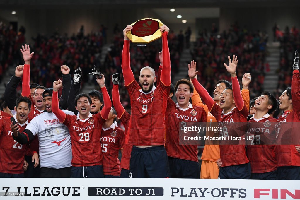 Robin Simovic Robin Simovic of Nagoya Grampus lifts the trophy as they celebrate ...