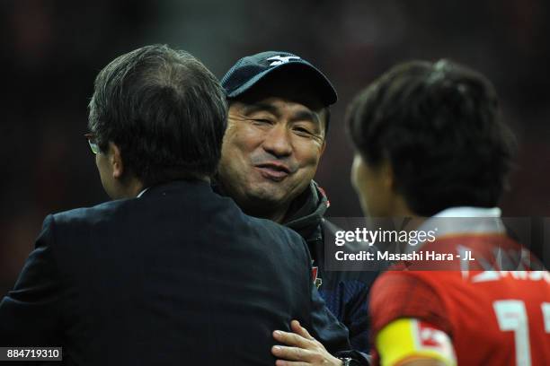 Head coach Yahiro Kazama of Nagoya Grampus is congratulated by club president Koki Konishi after the J.League J1 Promotion Play-Off Final between...