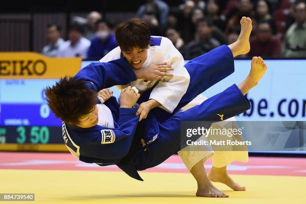 Ruika Sato of Japan competes against Mami Umeki of Japan in the Women's 78kg Bronze Final during day two of the Judo Grand Slam Tokyo at Tokyo...