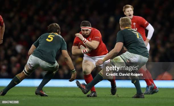 Wyn Jones of Wales takes on Lood de Jager and Pieter-Steph du Toit during the rugby union international match between Wales and South Africa at the...