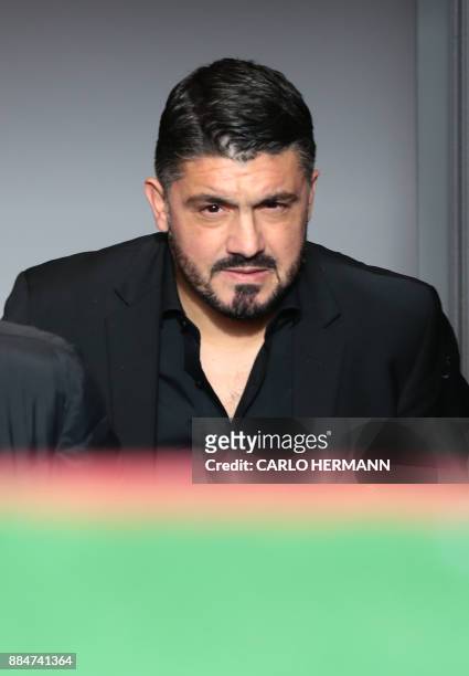 Milan's new coach Gennaro Gattuso enters the pitch before the Italian Serie A football match Benevento Calcio vs AC Milan on December 3, 2017 at the...