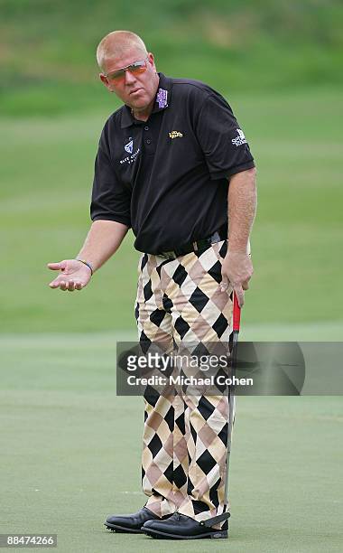 John Daly of the United States putts on the 13th green during the third round of the St. Jude Classic at TPC Southwind held on June 13, 2009 in...