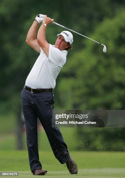 Phil Mickelson of the United States hits his second shot on the 13th hole during the third round of the St. Jude Classic at TPC Southwind held on...