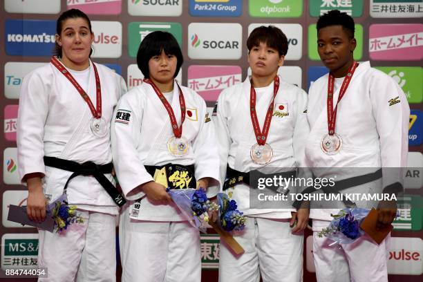 Women's under 78kg category gold medallist Shori Hamada of Japan poses with silver medallist Guusje Steenhuis of the Netherlands and bronze...