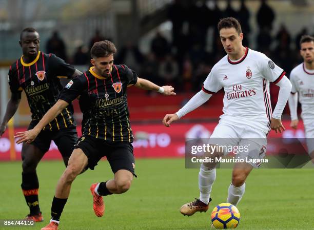 Marco D'Alessandro of Benevento competes for the ball with Giacomo Bonaventura of Milan during the Serie A match between Benevento Calcio and AC...