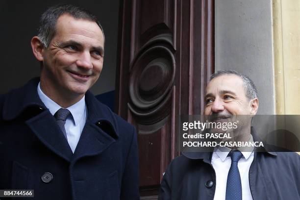Candidates for the Pe a Corsica nationalist party Gilles Simeoni and Jean Guy Talamoni speak after voting in Bastia on the French Mediterranean...
