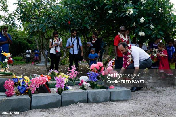 French Prime Minister Edouard Philippe deposits spray of flowers on the grave of the World War I infantryman Kalepo Wabete, who died in northern...