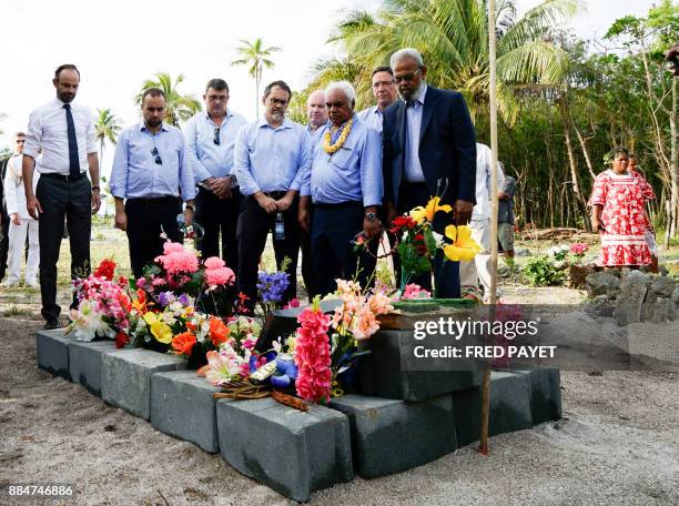 French Prime Minister Edouard Philippe pays respects by the grave of the World War I infantryman Kalepo Wabete, who died in northern France in 1918,...