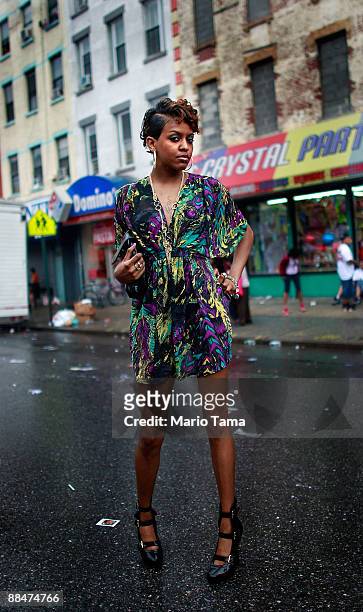 Chyna Smith looks on during the 116th Street Festival in Spanish Harlem June 13, 2009 in New York City. The 28-block festival draws around 100,000...