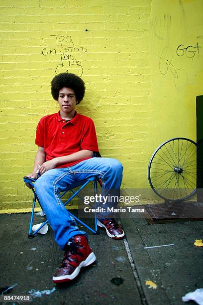Richard Ortiz looks on during the 116th Street Festival in Spanish Harlem June 13, 2009 in New York City. The 28-block festival draws around 100,000...