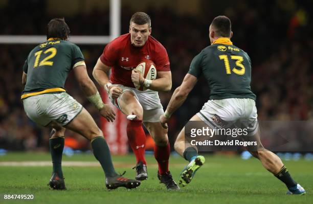 Scott Williams of Wales is tackled by Francois Venter and Jesse Kriel during the rugby union international match between Wales and South Africa at...