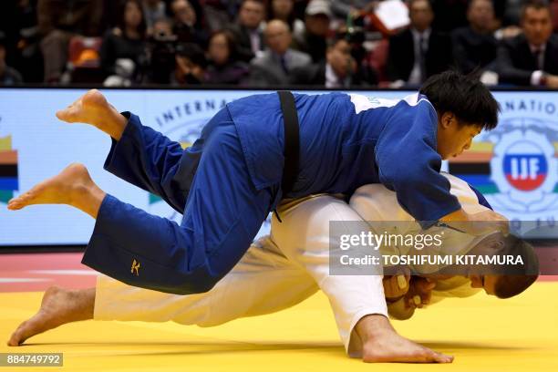 Stephan Hegyi of Austria fights with Kokoro Kageura of Japan during their men's over 100kg category bronze medal final match of the Judo Grand Slam...
