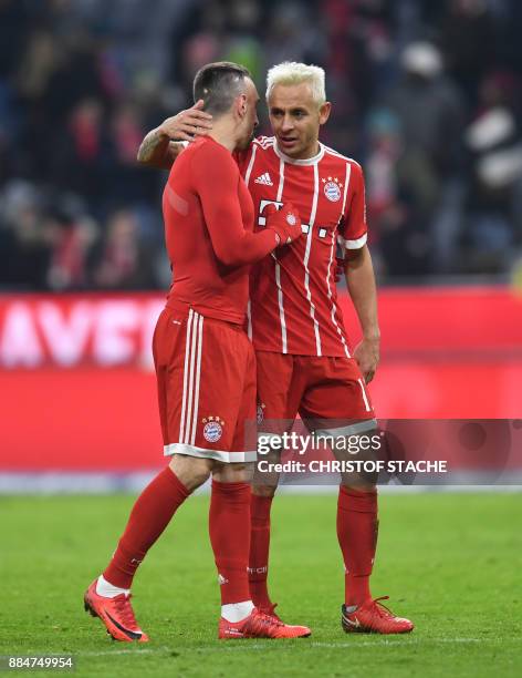 Bayern Munich's Brazilian defender Rafinha embraces his teammate midfielder Franck Ribery after the German First division Bundesliga football match...