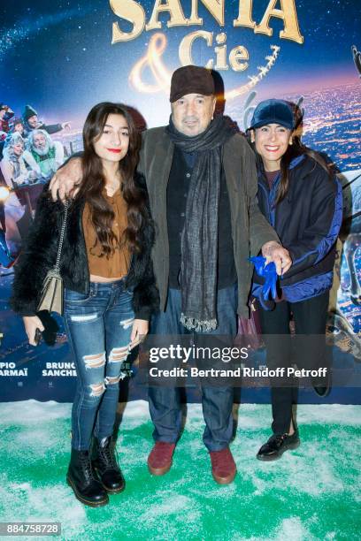 Kiara Carriere, her Father Jean-Claude Carriere and her Mother Nahal Tajadod attend "Santa & Cie" Paris Premiere at Cinema Pathe Beaugrenelle on...