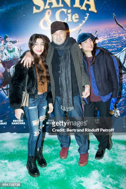 Kiara Carriere, her Father Jean-Claude Carriere and her Mother Nahal Tajadod attend "Santa & Cie" Paris Premiere at Cinema Pathe Beaugrenelle on...