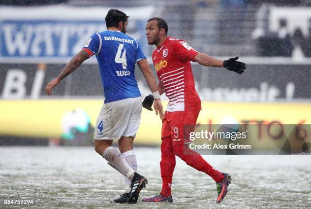 Aytac Sulu of Darmstadt argues with Jann George of Regensburg during the Second Bundesliga match between SV Darmstadt 98 and SSV Jahn Regensburg at...