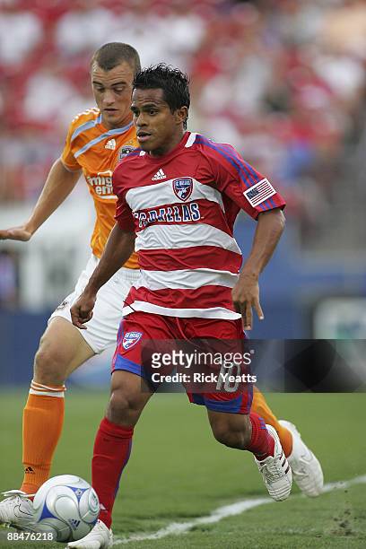 David Ferreira of the FC Dallas defends the ball from Cam Weaver of the Houston Dynamo at Pizza Hut Park on June 13, 2009 in Frisco, Texas.