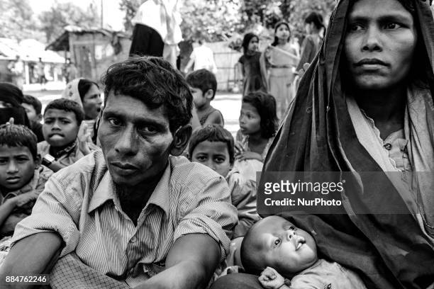 Newly arrived Rohingya refugees wait at a relief centre after crossing the Bangladesh-Myanmar border in the Teknaf area, Bangladesh, November 29,...