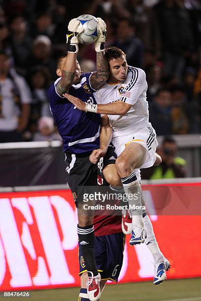 Alan Gordon of the Los Angeles Galaxy collides in the box with goalkeeper Nick Rimando of Real Salt Lake during their MLS game at The Home Depot...
