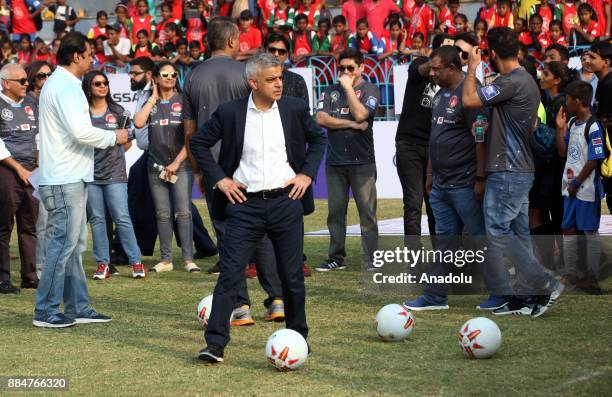 British politician and Mayor of London Sadiq Khan prepares to kick a soccer ball during the 9th 'QPR South Mumbai Junior Soccer Challenger 2017'...