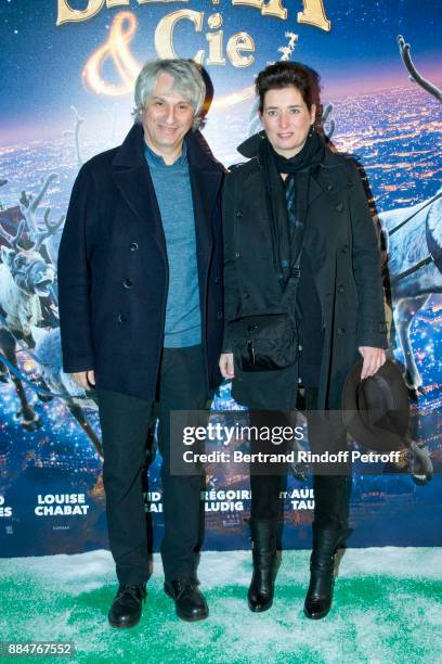 Producers Alain Goldman and Sidonie Dumas Seydoux attend "Santa & Cie" Paris Premiere at Cinema Pathe Beaugrenelle on December 3, 2017 in Paris,...