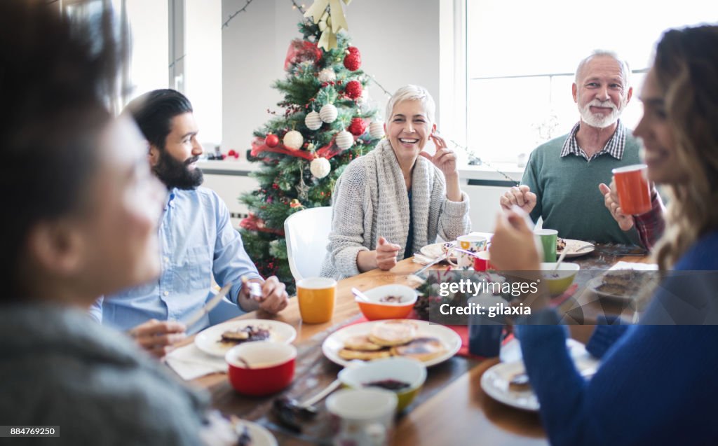 Family having breakfast on Christmas morning.