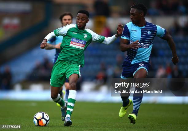 Sean Theobald of Letherhead is challenged by Anthony Stewart of Wycombe Wanderers during The Emirates FA Cup Second Round between Wycombe Wanderers...