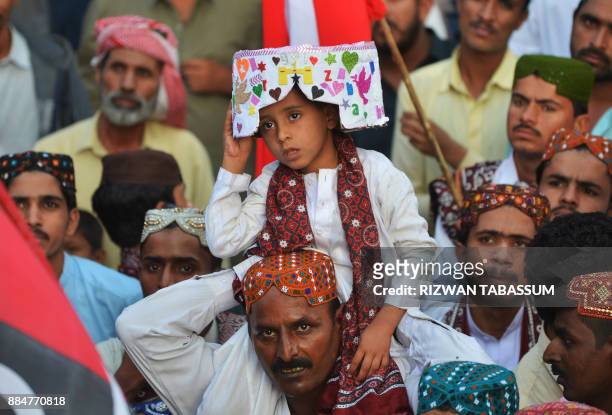 Sindhi people gather to mark Sindhi Culture Day in Karachi on December 3, 2017. / AFP PHOTO / RIZWAN TABASSUM