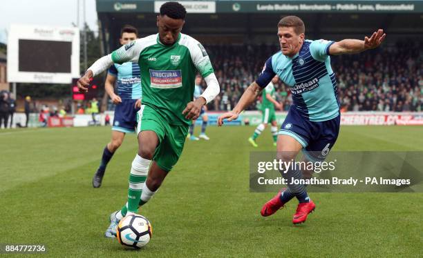 Leatherhead's D'Sean Theobald and Wycombe Wanderers' Adam El-Abd during the Emirates FA Cup, second round match at Adams Park, Wycombe.