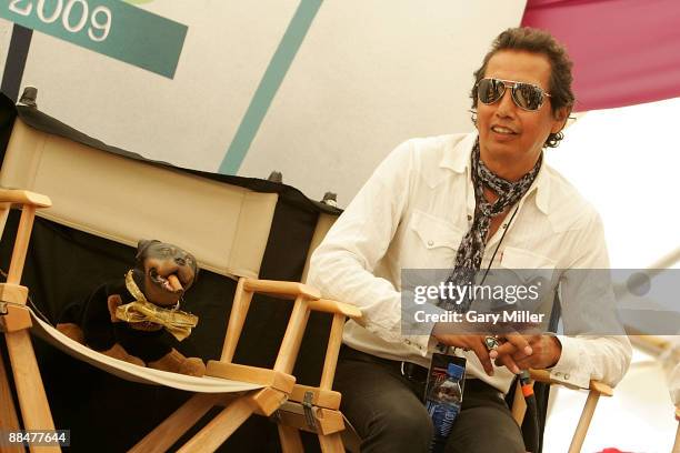 Musician Alejandro Escovedo and Triumph The Insult Comic Dog answer questions in the press tent during the 2009 Bonnaroo Music and Arts Festival on...