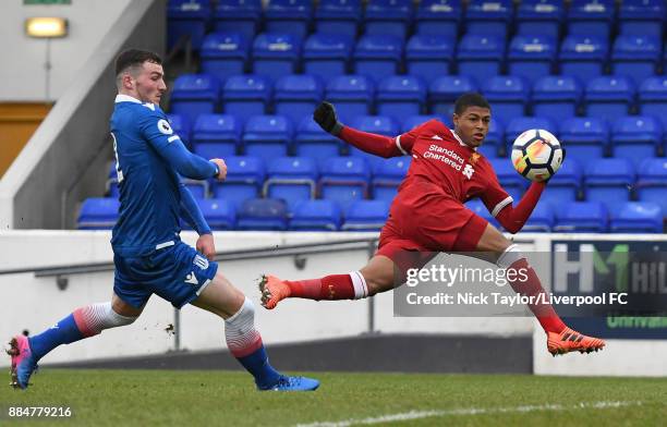 Rhian Brewster of Liverpool and Thomas Edwards of Stoke City in action during the Liverpool v Stoke City Premier League Cup game at The Swansway...