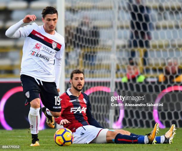 Fabio Pisacane of Cagliari Calcio competes for the ball whit Mattia Destro of Bologna FC during the Serie A match between Bologna FC and Cagliari...