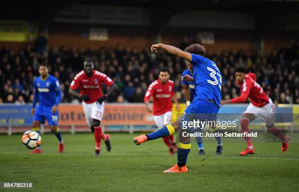 Lyle Taylor of AFC Wimbledon scores his sides third goal during the The Emirates FA Cup Second Round match between AFC Wimbledon Charlton Athletic at...