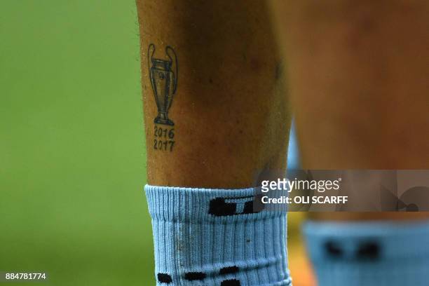 Tattoo of the UEFA Champions League trophy, is pictured on the lego of Manchester City's Brazilian defender Danilo during the English Premier League...