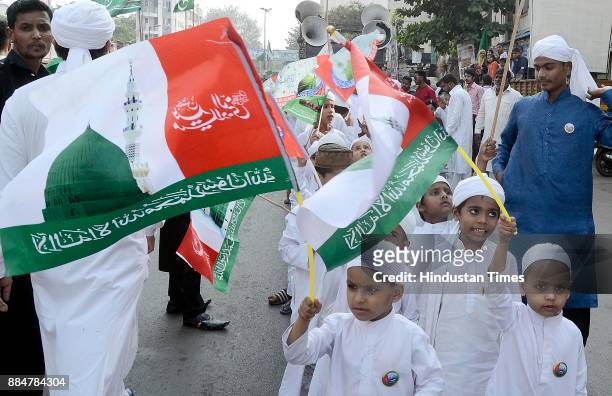 Muslim devotees take part in a procession during Eid Milad-Un-Nabi - the birth anniversary of Prophet Muhammad - the founder of Islam, also believed...