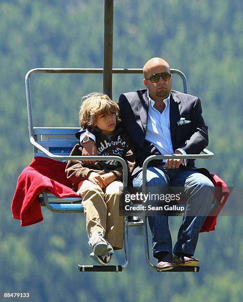 Luis Garcia Fanjul, best man at the wedding of Boris Becker, and Becker's younger son Elias ride a ski lift to the wedding brunch reception of former...