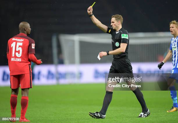 Referee Soeren Storks shows Jetro Willems of Eintracht Frankfurt the yellow card during the game between Hertha BSC and the Eintracht Frankfurt on...