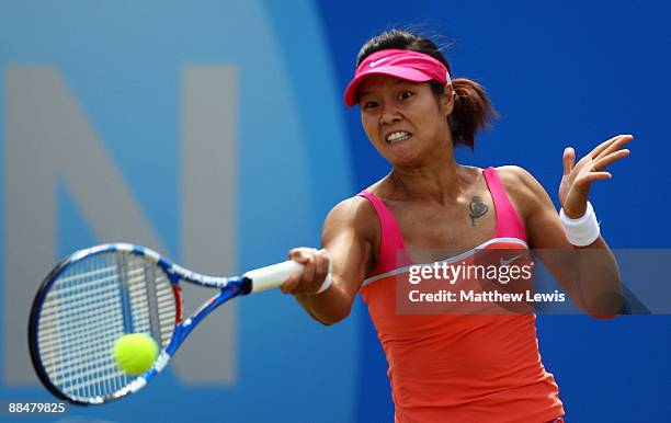 Na Li of China in action against Magdalena Rybarikova of Slovakia during day Seven of the AEGON Classic at the Edgbaston Priory Club on June 14, 2009...
