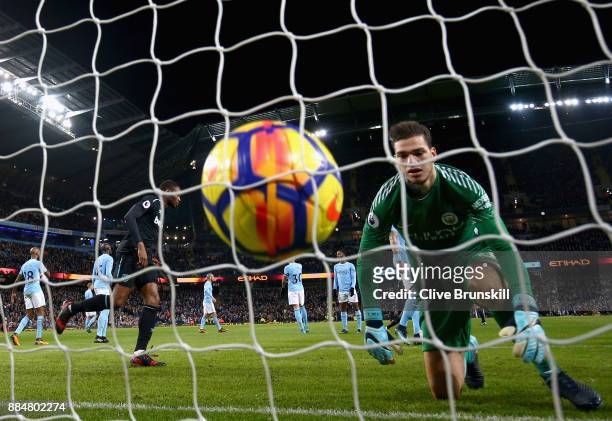 Angelo Ogbonna of West Ham United scores his sides first goal past Ederson of Manchester City during the Premier League match between Manchester City...
