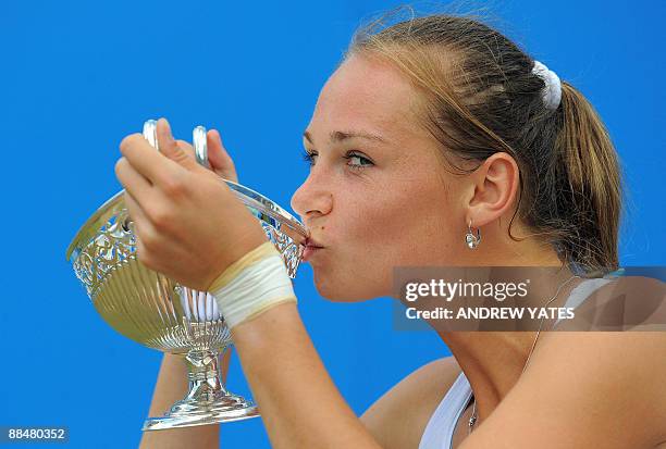 Magdalena Rybarikova of Slovakia kisses the Maud Watson trophy after winning the WTA AEGON classic tennis tournament final against China's Li Na at...