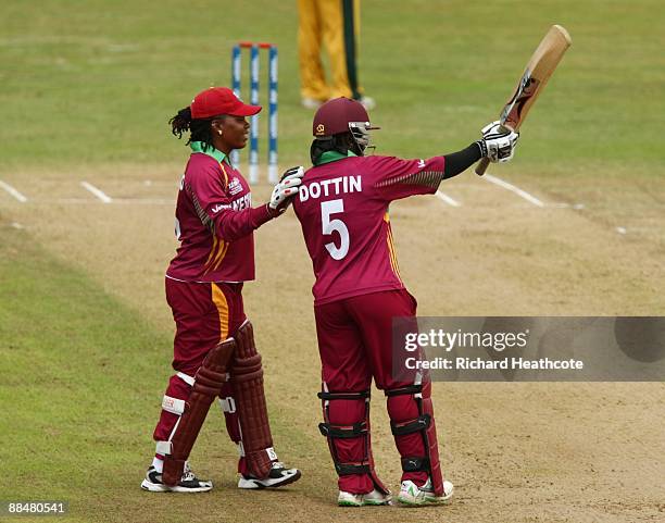 Deandra Dottin of West Indies celebrates reaching her half century with team mate Juliana Nero during the ICC Women's Twenty20 World Cup match...