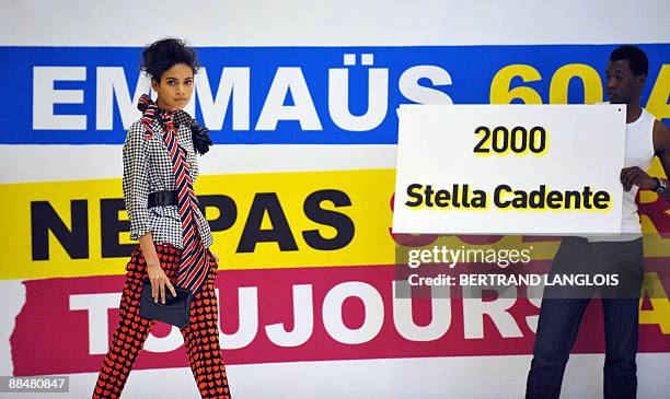 Model presents an outfit created in 2000 by French designer Stella Cadente during a fashion show at the 10th fair of French homeless charity...