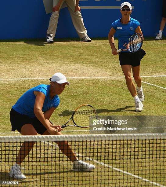 Liezel Huber of the United States and Cara Black of Zimbabwe in action against Raquel Kops-Jones and Abigail Spears of the United States during day...