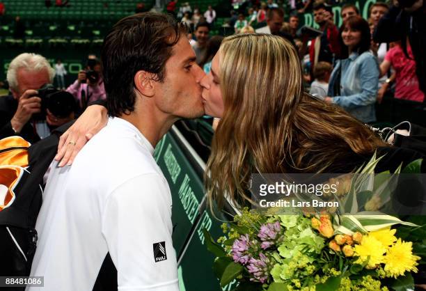 Tommy Haas of Germany kisses his girlfriend Sara Foster, an American actress, after winning the final of the Gerry Weber Open against Novak Djokovic...