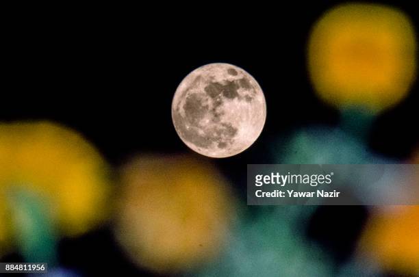 Full "Supermoon" rises in the early hours of December 3, 2017 in Srinagar, the summer capital of Indian administered Kashmir, India. Supermoon is a...