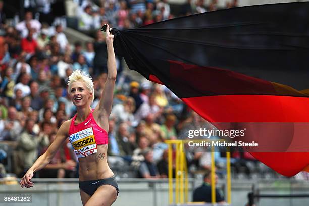 Ariane Friedrich of Germany celebrates victory after clearing 2.06m and setting a new German record during the women's high jump during the DKB-ISTAF...