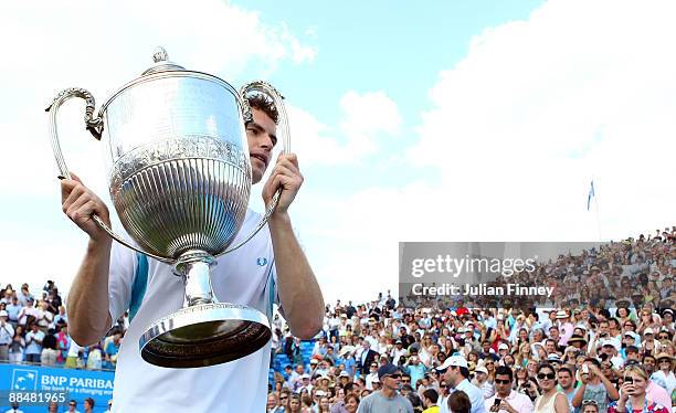 Andy Murray of Great Britain celebrates winning the match and the Championship with the trophy during the men's final match against James Blake of...