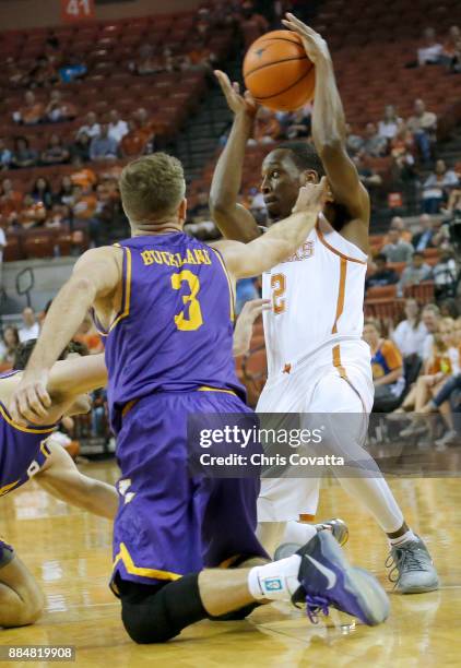 Matt Coleman of the Texas Longhorns holds the ball away from Michael Buckland of the Lipscomb Bisons at the Frank Erwin Center on November 18, 2017...