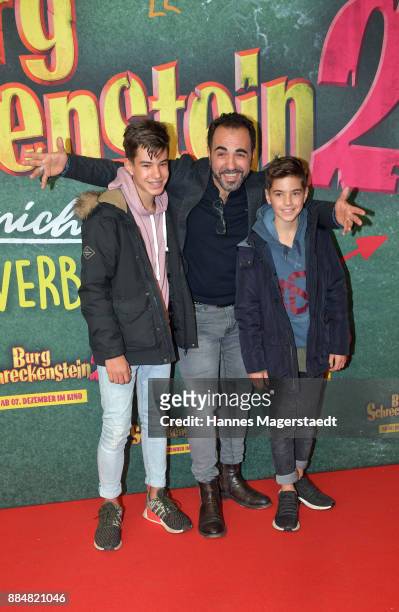 Actor Adnan Maral and his sons Can and Acun during the 'Burg Schreckenstein 2' Premiere at Mathaeser Filmpalast on December 3, 2017 in Munich,...